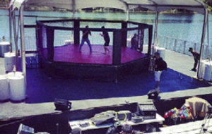 An image of people boxing inside a tent
